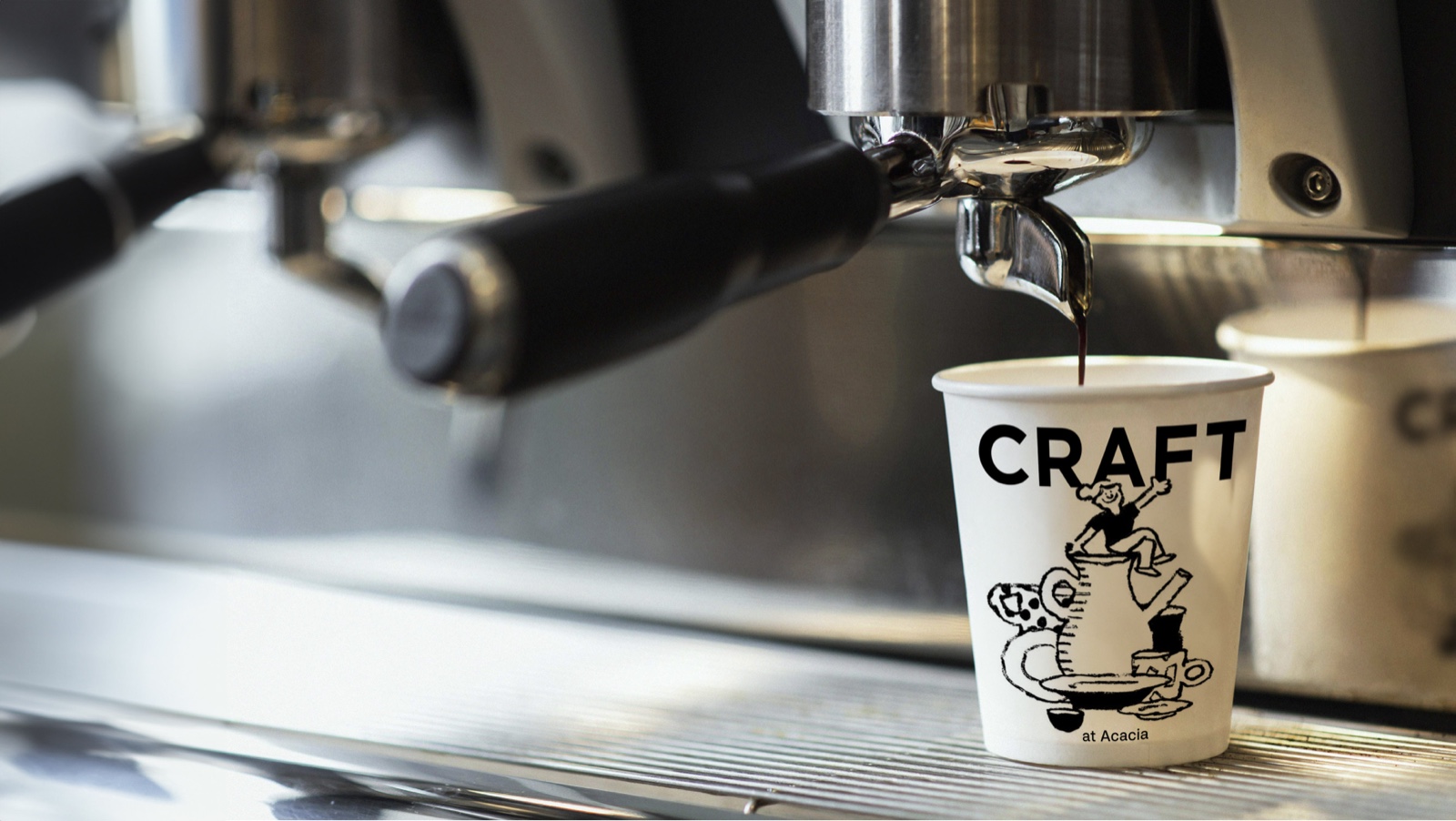 Espresso pouring into a Craft paper cup