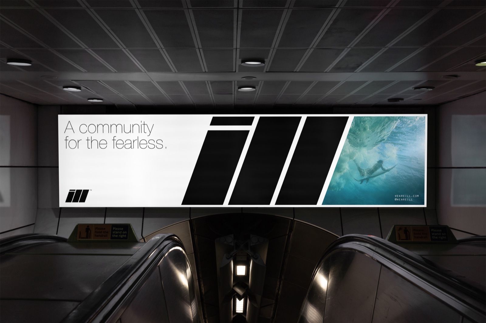 ILL billboard above an escalator: A community for the fearless