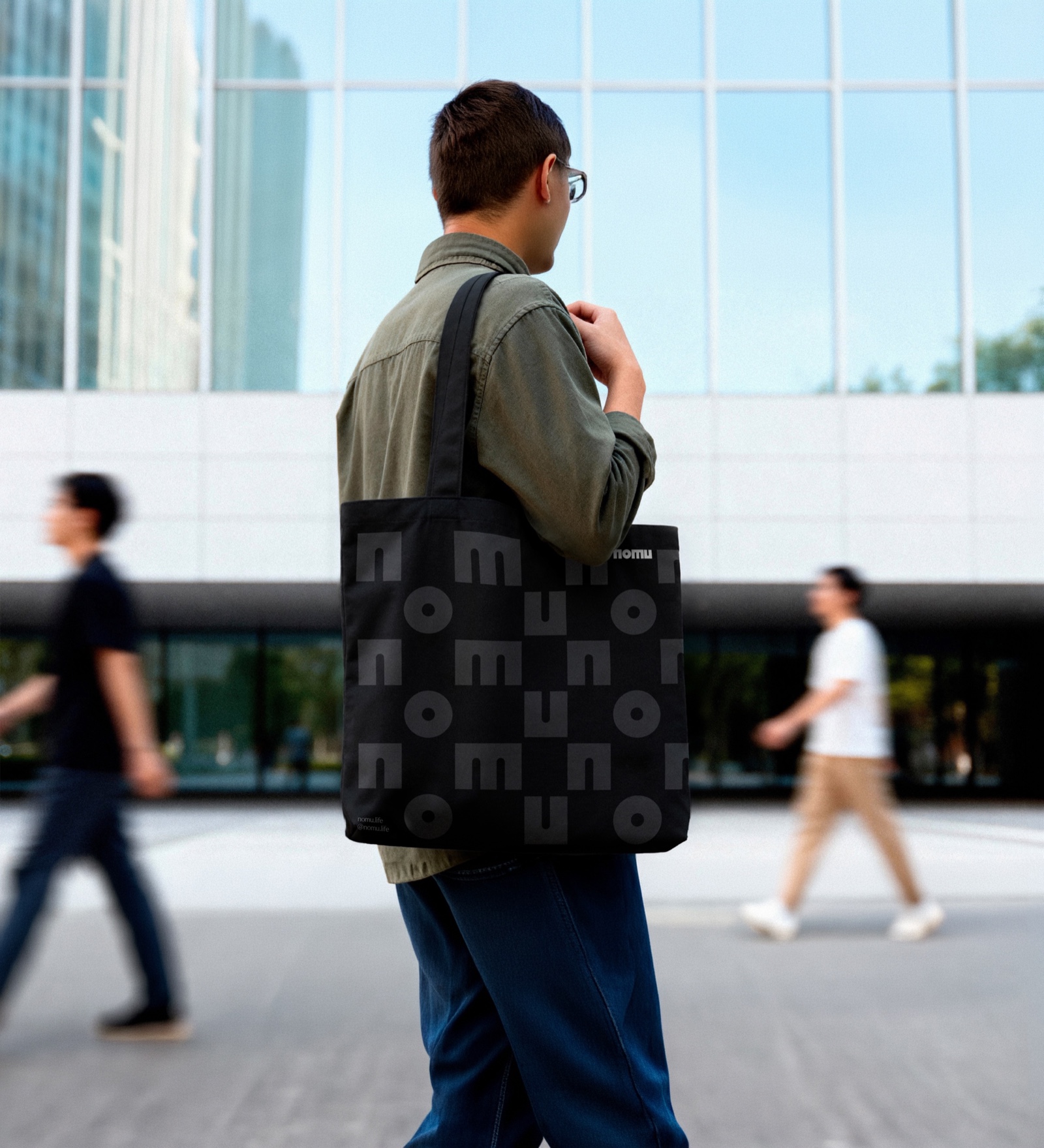 Nomu patterned tote bag on a shoulder
