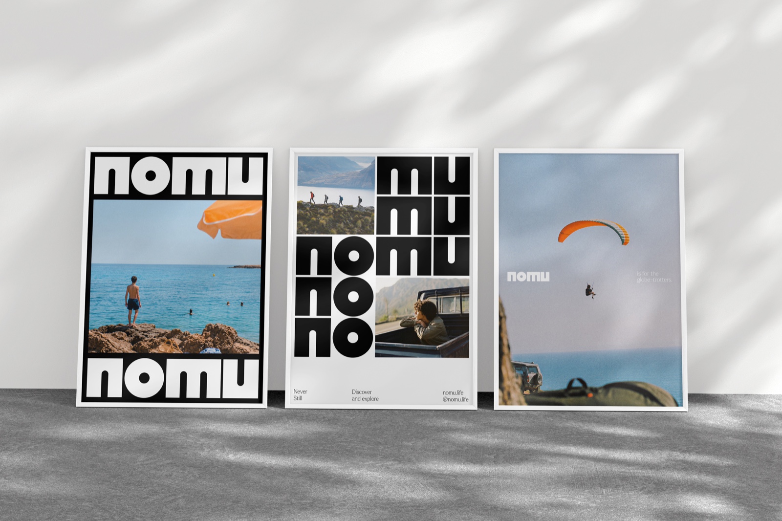 Three framed Nomu posters leaning on a wall