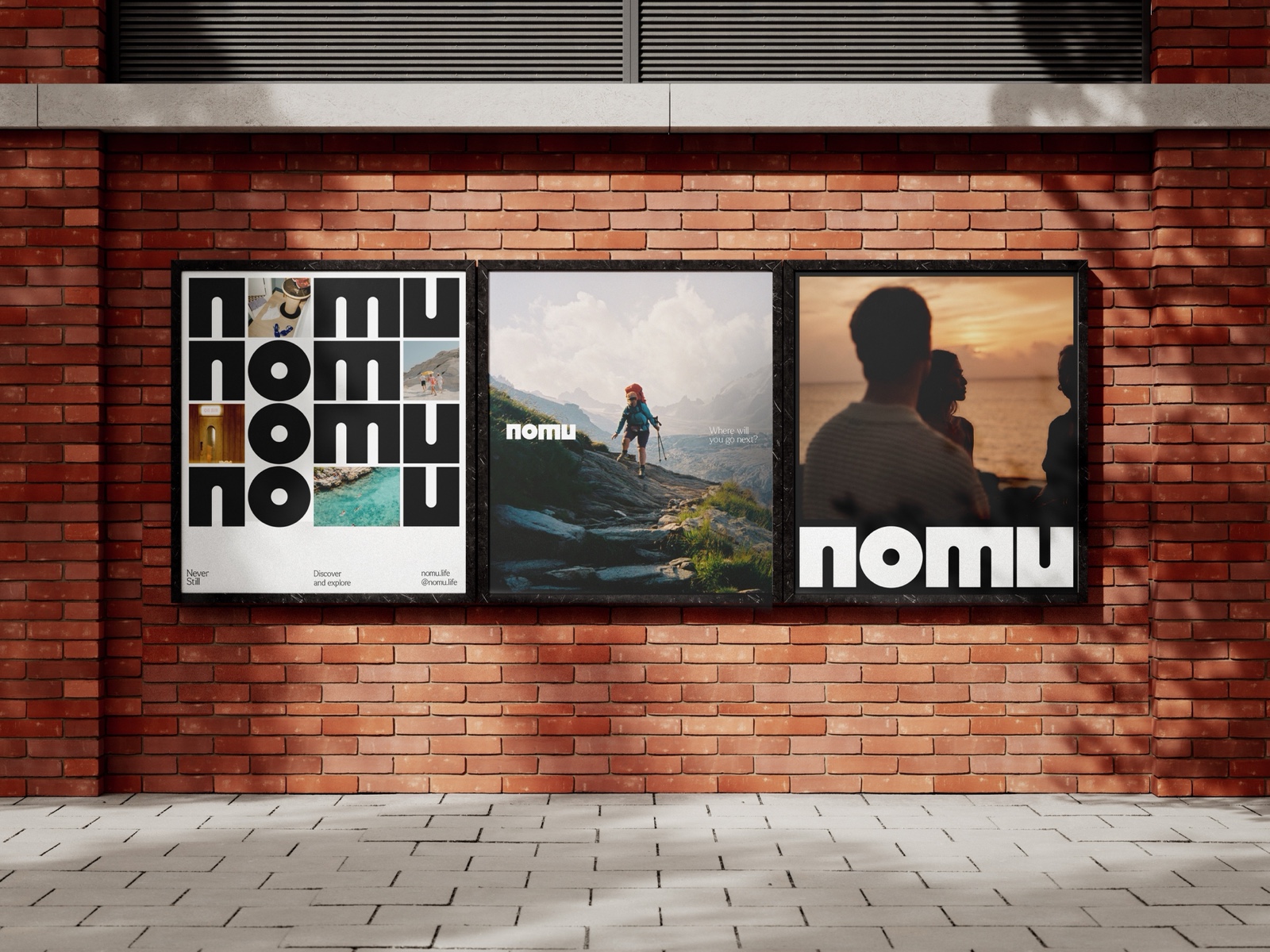 Three Nomu posters on a brick wall