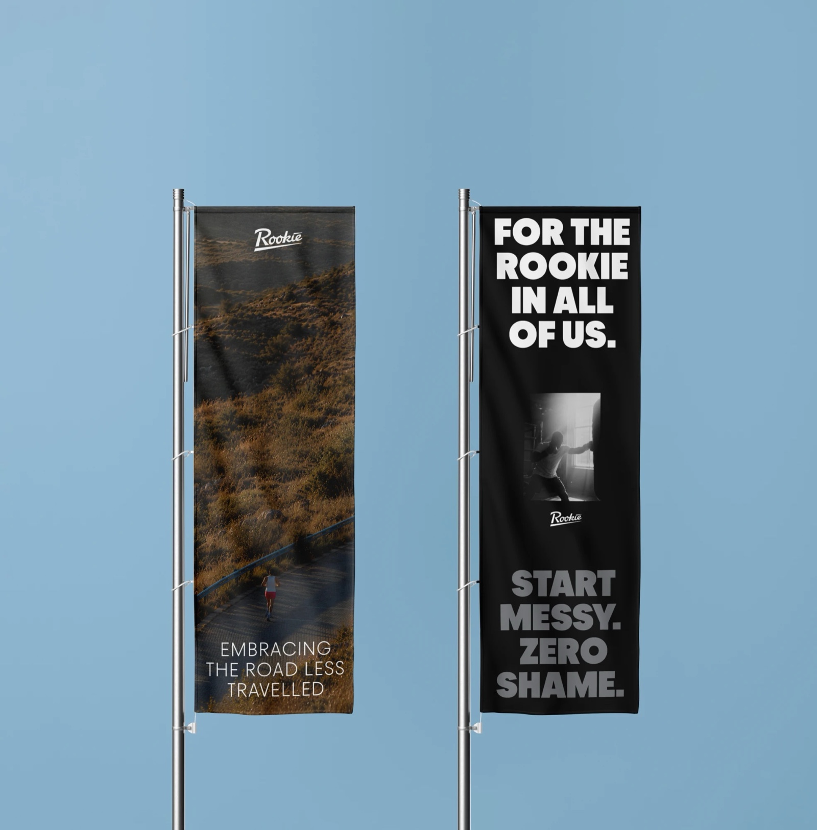 Two Rookie flags on poles against a blue sky: Embracing the road less travelled, and For the Rookie in all of us