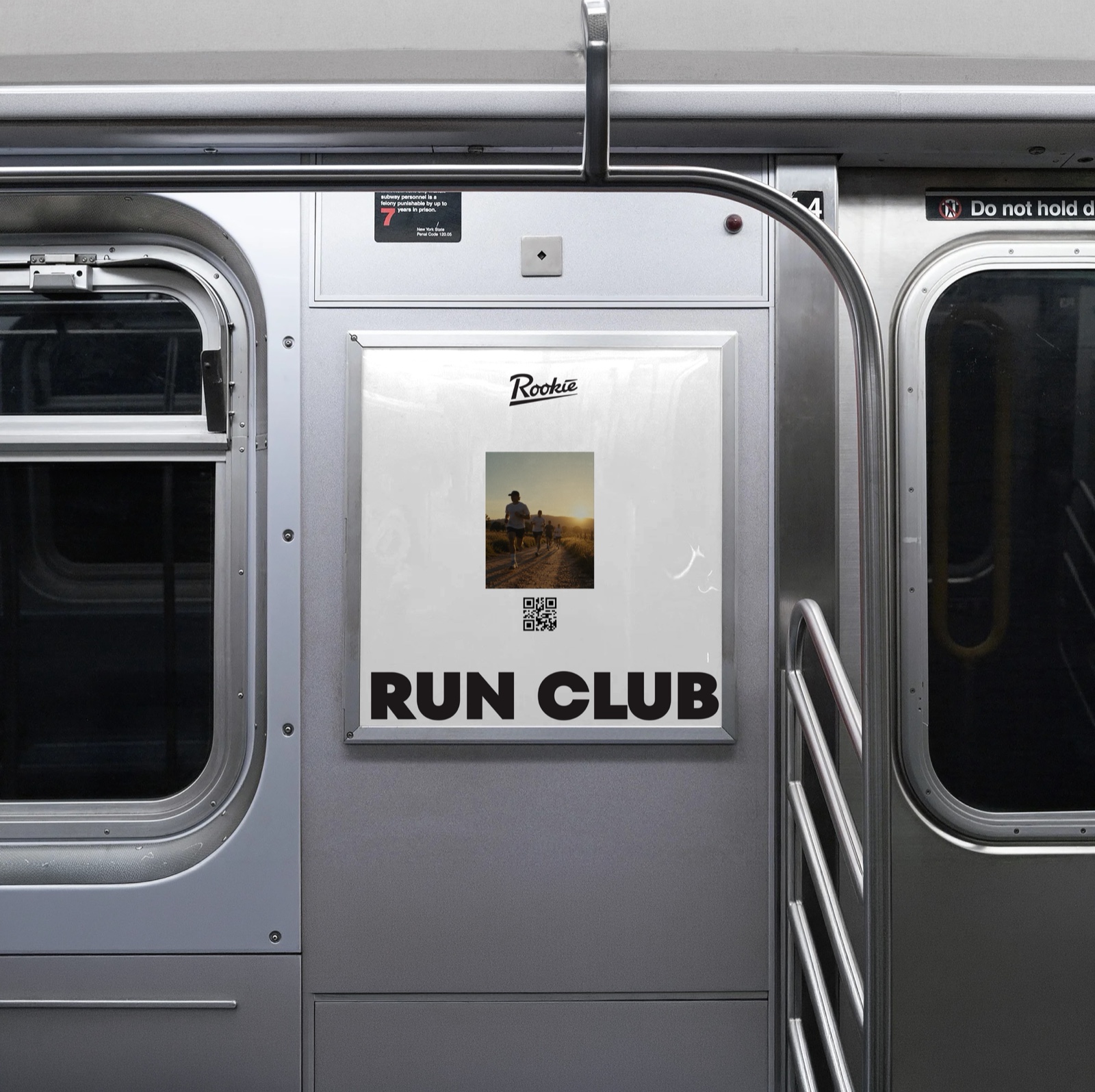 Rookie Run Club poster in a subway car frame