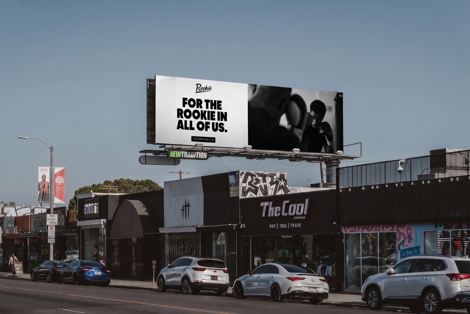 Rookie billboard over a row of shops: For the Rookie in all of us, with a boxer