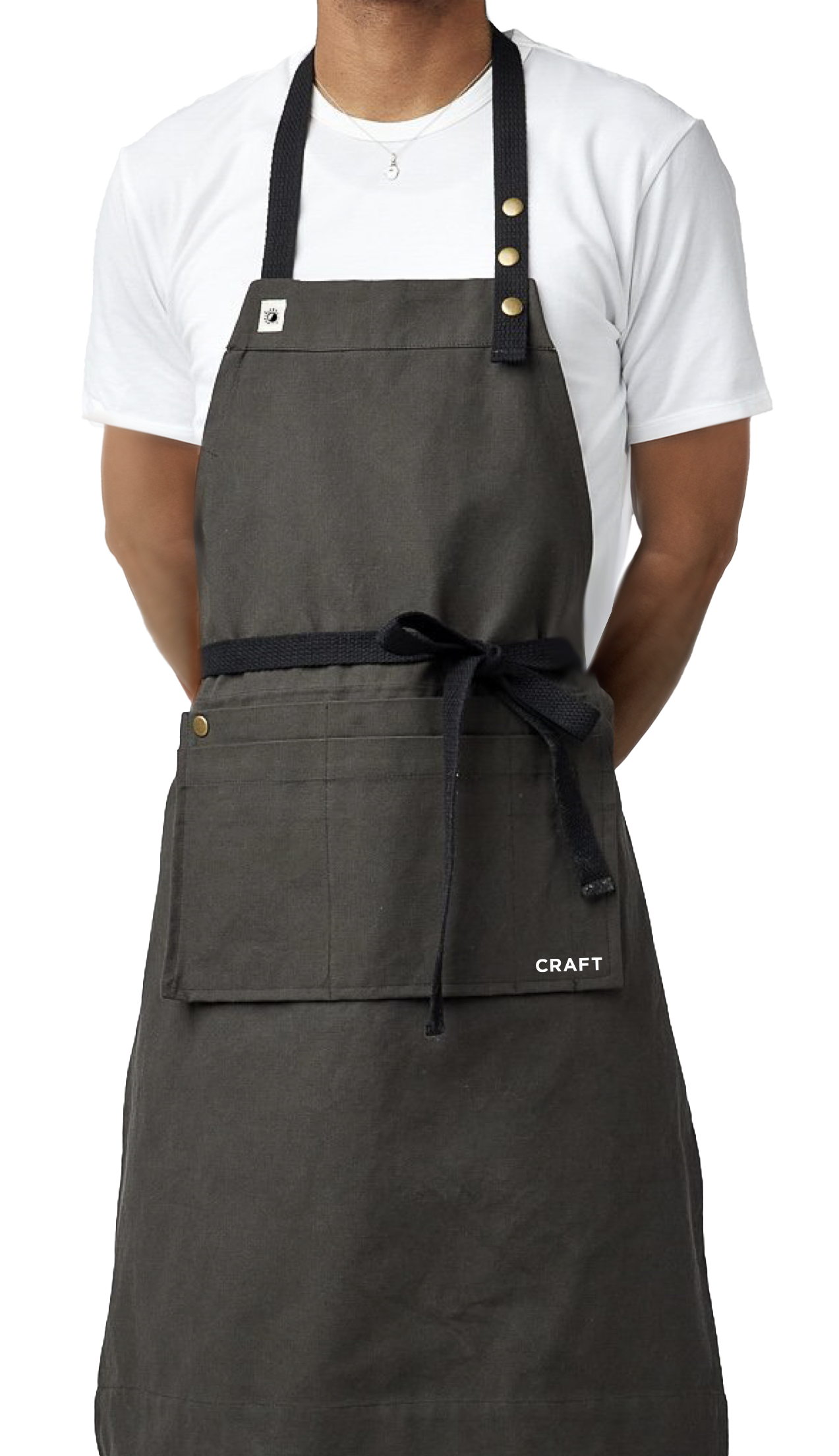 Craft apron on a light grey background with the wordmark gliding behind it